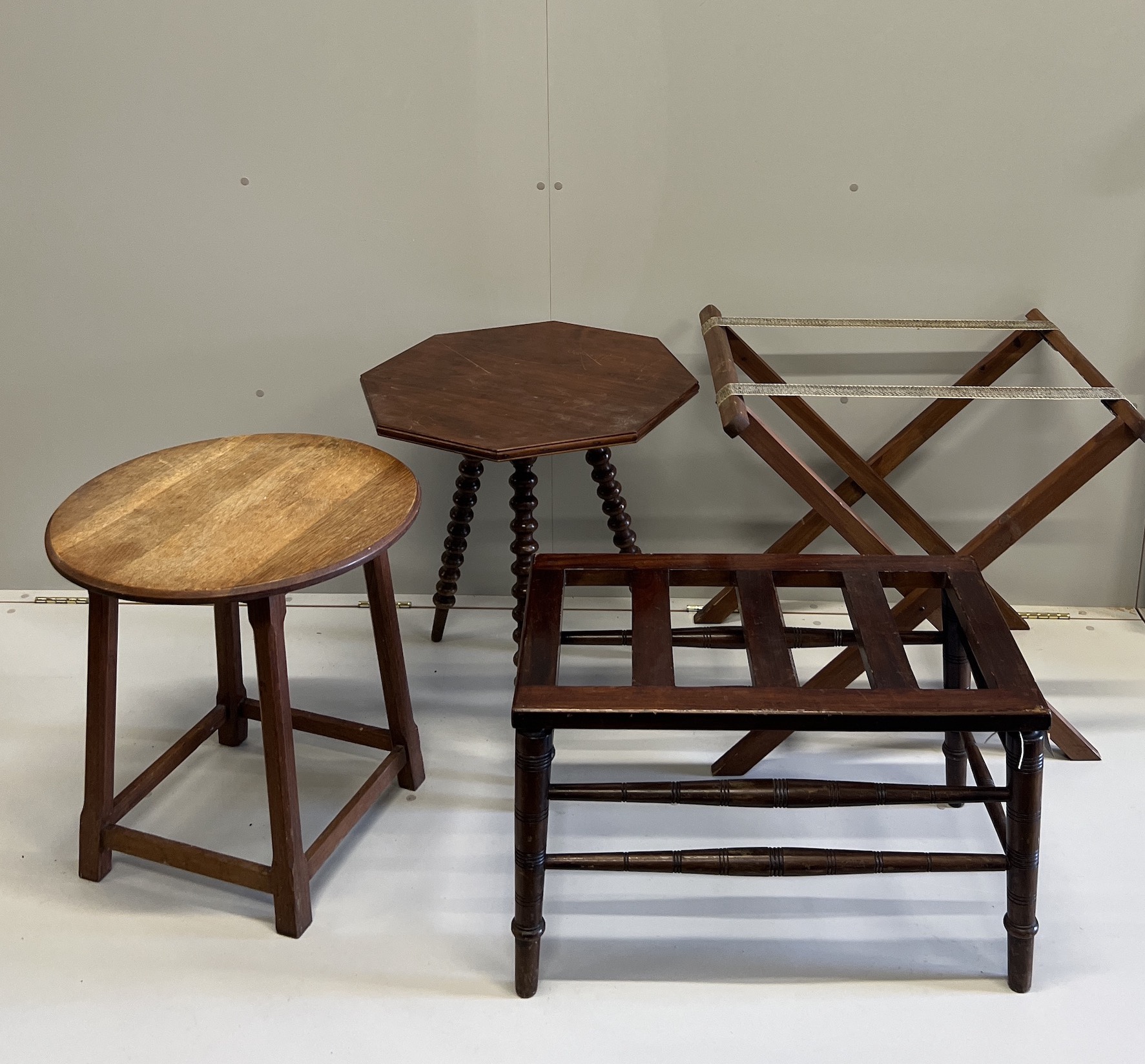 A late Victorian mahogany luggage rack, an octagonal occasional table, a circular oak table, butler's tray stand and an elbow chair